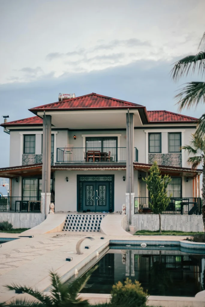 Homes for sale in North Naples FL with palm trees and landscaped yard